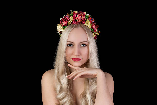 istock Beautiful model in flower crown with hand near face 502149740