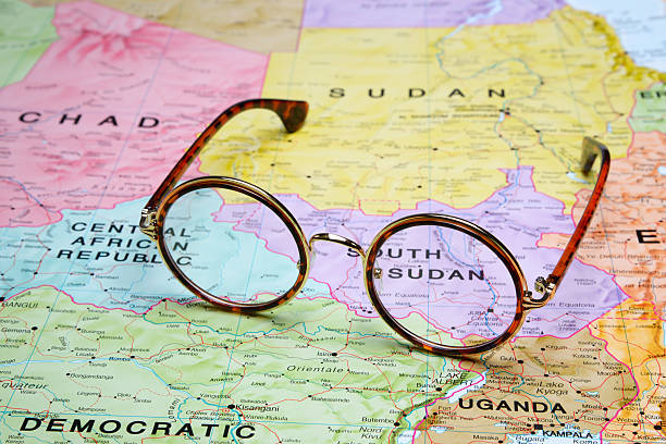 Glasses on a map - Juba Photo of glasses on a map of Africa. Focus on Juba. May be used as illustration for traveling theme. south sudan stock pictures, royalty-free photos & images