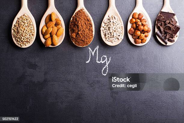 Products Rich In Magnesium On Wooden Spoons Stock Photo - Download Image Now - Composition, Food, Magnesium