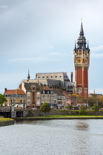 Calais, France - November 07, 2015: City hall of Calais. The town hall of Calais was built in 1885 on the  merging of the cities of Calais and Saint-Pierre, on a barren piece of land at between the two cities. It was designed in the neo-Flemish style of the 15th century, by the architect Louis Debrouwer