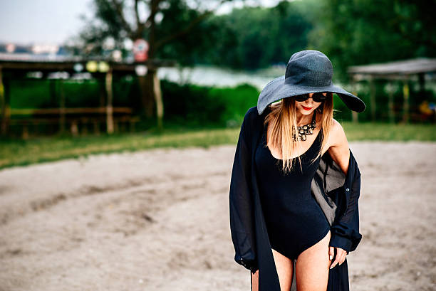 istock Young pretty women walking on the beach 502154430