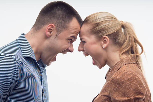 istock Colleagues fighting each other with foreheads together 502155809