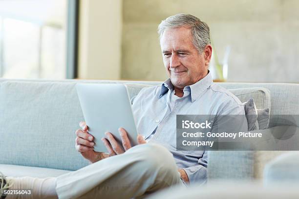 Keeping Himself Up To Date Stock Photo - Download Image Now - Active Lifestyle, Active Seniors, Adult