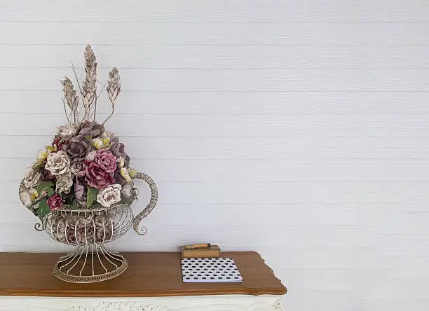 Guest Corner, Big Vintage Style Flowerpot at the Corner of Wooden Table with Guest book on White Wooden Wall used as Template to input Text