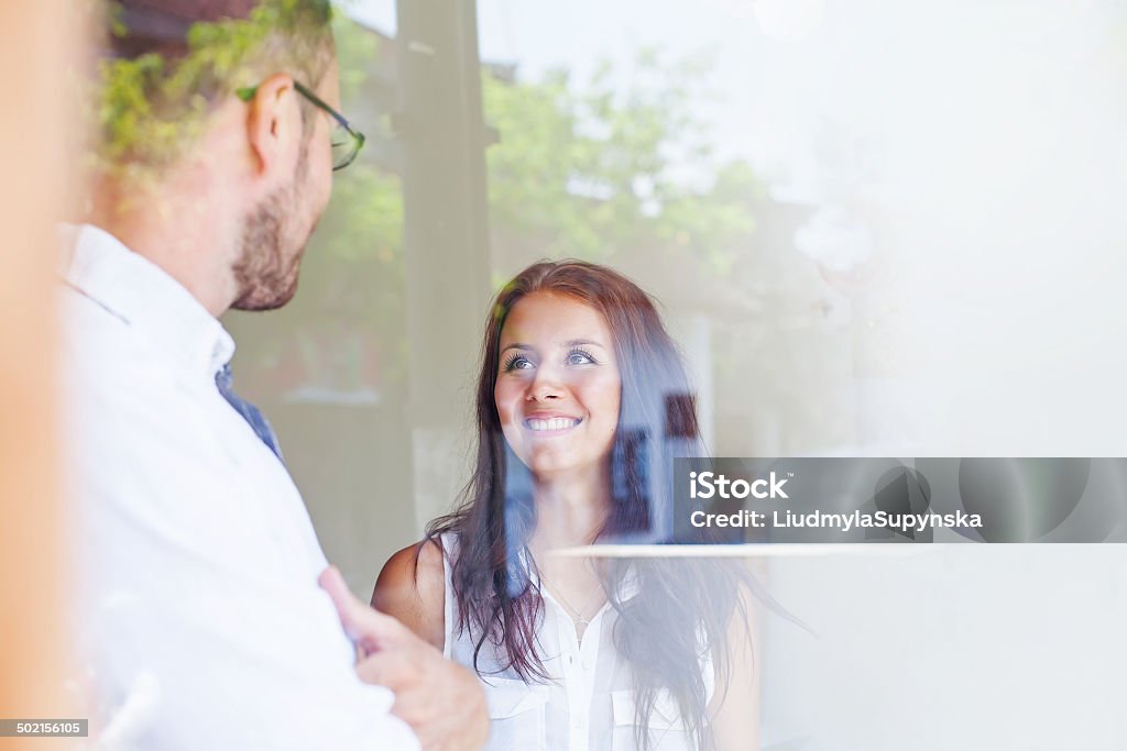 business people through the glass view through the window 20-29 Years Stock Photo