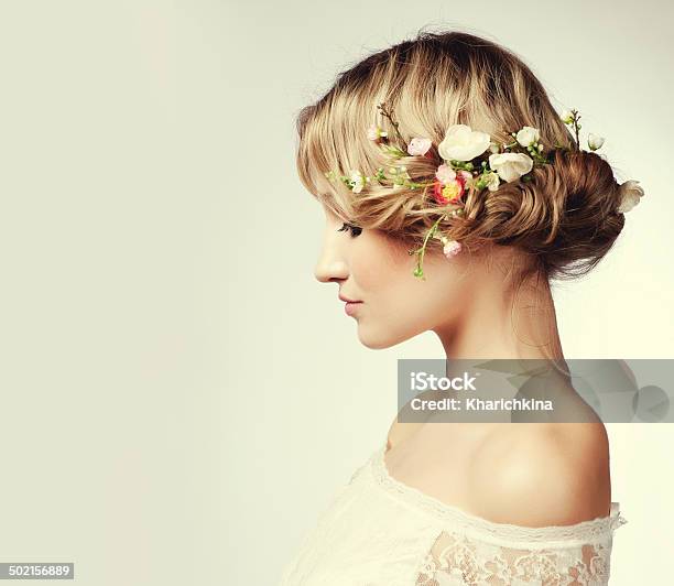 Portrait Of A Beautiful Woman With Flowers In Her Hair Stock Photo - Download Image Now