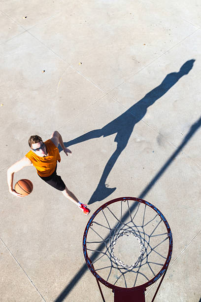 istock Basketball player goes toward the hoop 502157642