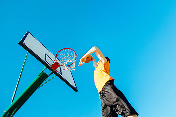 istock Basketball player placing ball in the hoop. 502157662