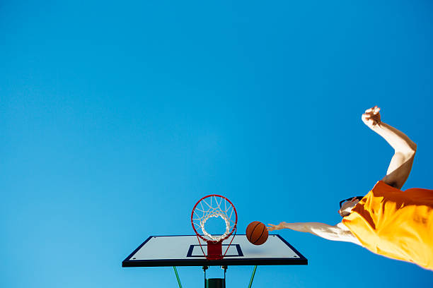 istock Basketball player dunks the ball into the hoop 502157668