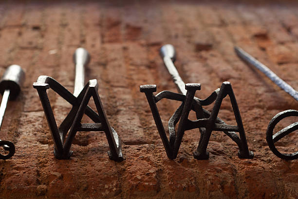 branding irons - brandmarken stock-fotos und bilder