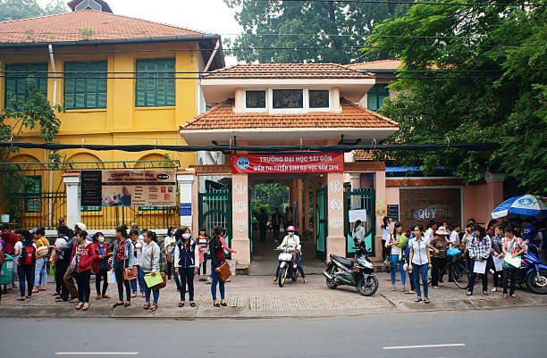 Ho chi Minh city, Vietnam - July 5, 2014: Pupil finish exam time in examination season to select university for future, crowd of examinee leave school, Vietnam, July 5, 2014