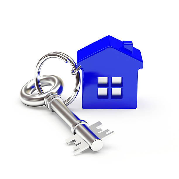 istock Mortgage concept. Silver key with blue house 502159290