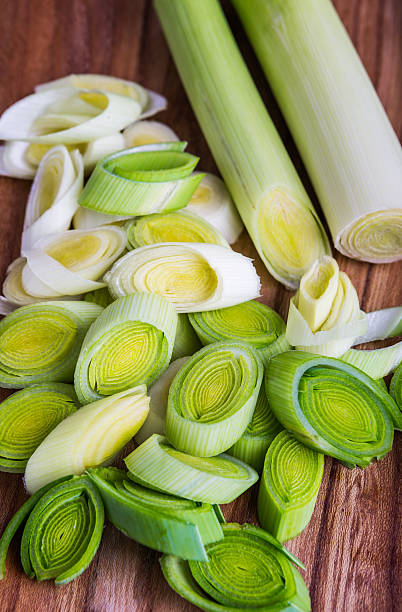 istock Fresh leeks whole and sliced on a wooden kitchen board 502160720