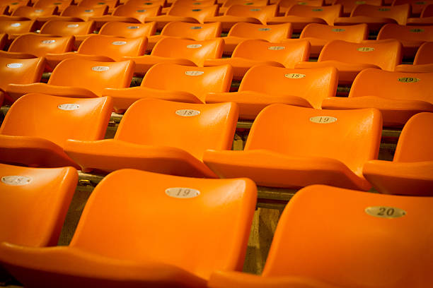 istock empty orange seating in sport stadium 502161936