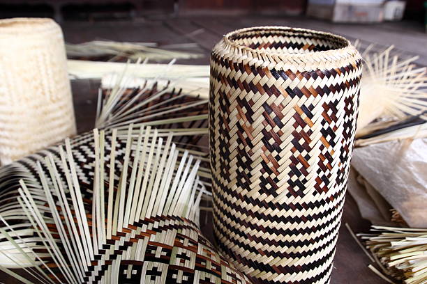 Decorative wicker baskets in bathroom shelf