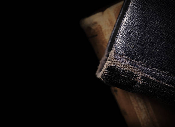 istock Old books isolated on black background 502162420