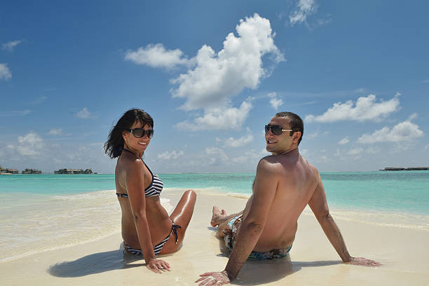 istock happy young couple have fun on beach 502162692