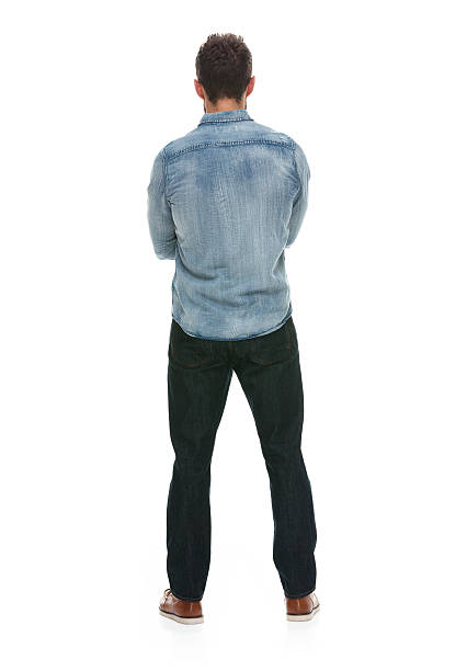 istock Rear view casual man standing with arms crossed 502162768