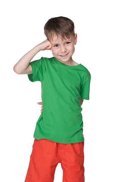 istock Cute little boy stands against the white 502164976