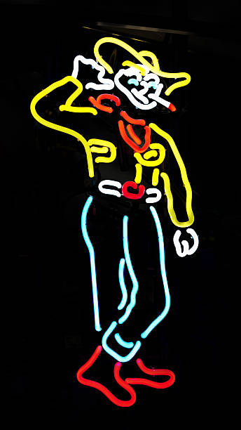 Neon sign of smoking cowboy against a black background.