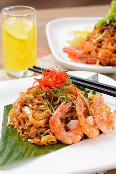 istock Close-up stir fried char kuey teow and drink 502165394