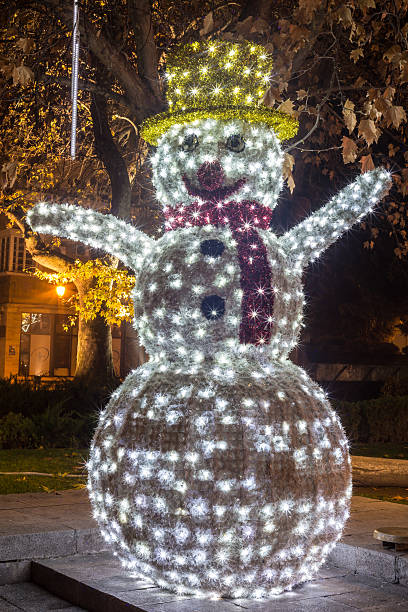 istock Snowman with Christmas lights 502165520