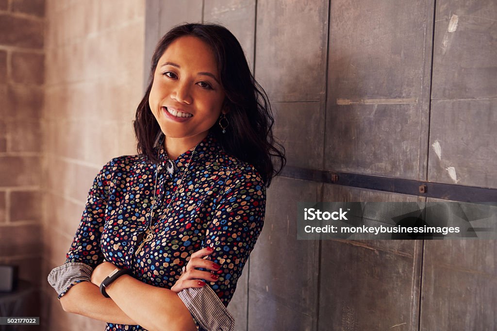 Portrait Of Female Designer Standing In Modern Office Design Professional Stock Photo