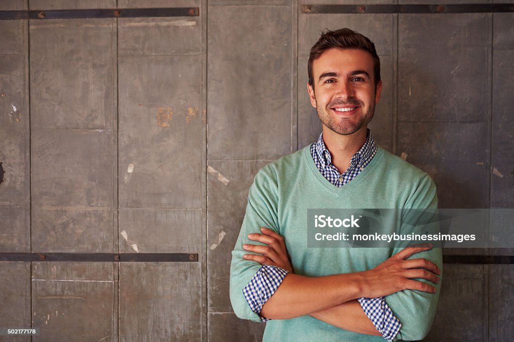 Portrait Of Male Designer Standing In Modern Office Men Stock Photo