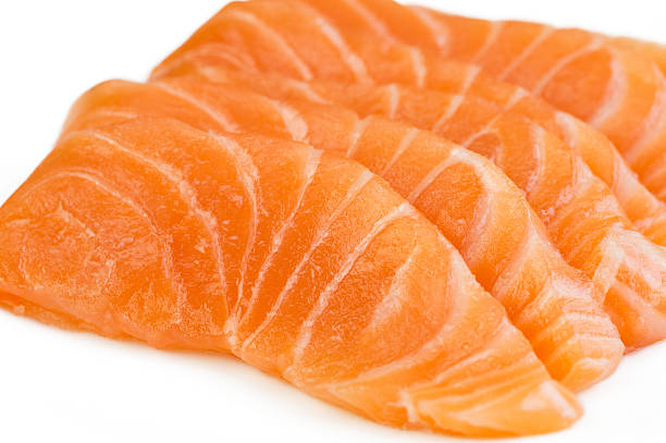 istock Sliced raw salmon isolated on white background 502181420