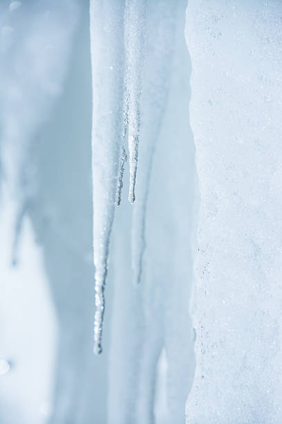 istock Winter background. Ice stalactites that drips 502182216