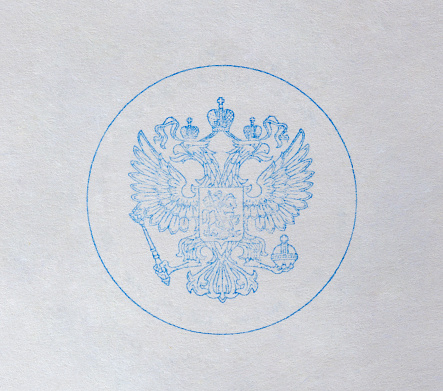 A print of the double-headed eagle on the white paper.