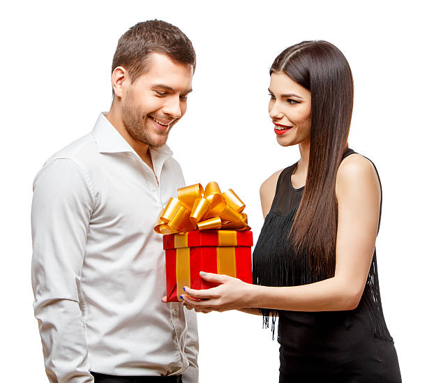 istock Young beautiful couple with present isolated on white 502188380