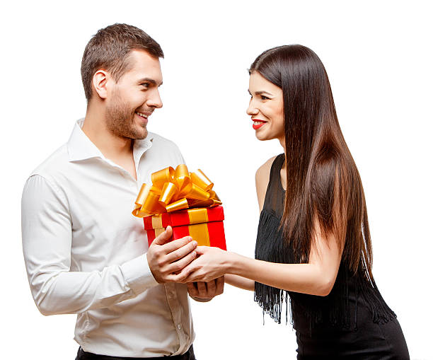 istock Young beautiful couple with present isolated on white 502188410