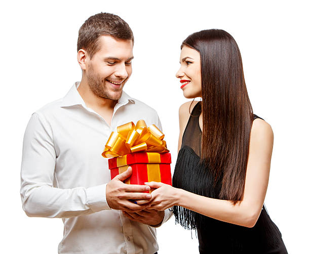 istock Young beautiful couple with present isolated on white 502188450