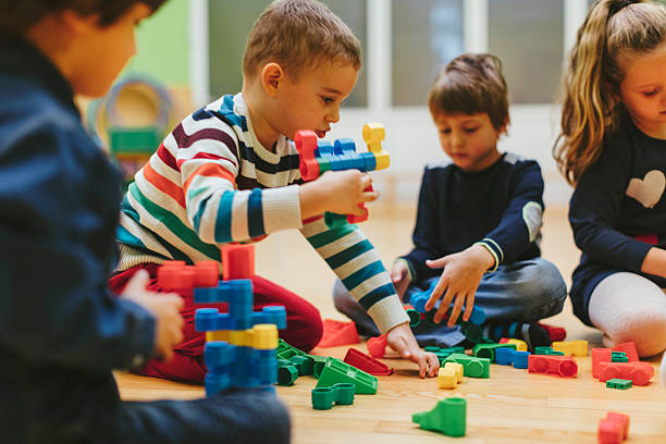 istock Children playing with blocks in kindergarten. 502188666