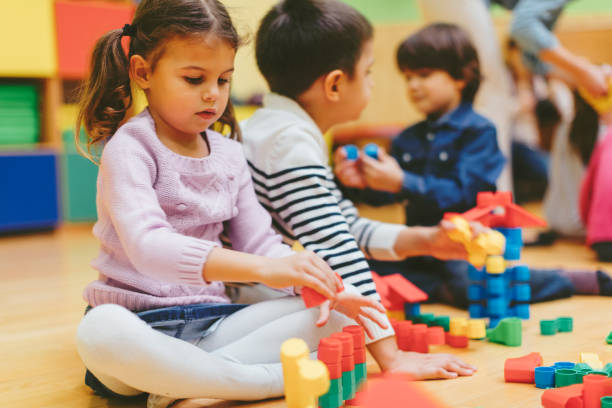 istock Children playing with blocks in kindergarten. 502188798