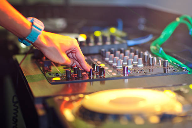 istock DJ mixing music on console at the night club 502189094