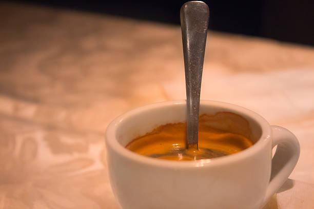 Cup of hot coffee with spoon in it