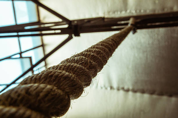 istock Brown climbing rope hanging from roof 502189936