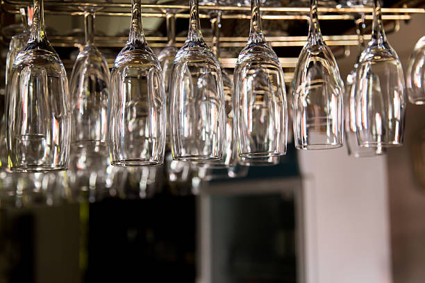 istock different types of glass hung up on bar 502190512