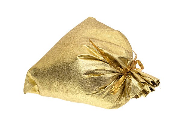 istock Tied gold gift bag on white background 502190738