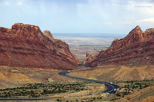 istock Trucks drive along road that winds through Spotted Wolf Canyon 502191682