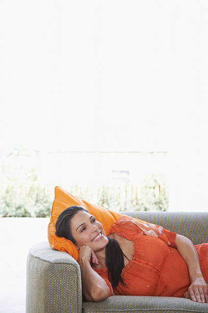 istock Woman Lying In Sofa; Smiling 502192083