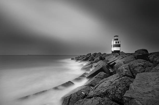 istock Lighthouse on South pier of Ijmuiden. 502193322