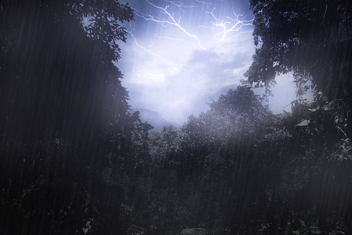 Cropped shot a thunderstorm over a mountain as seen through a clearing in the foresthttp://195.154.178.81/DATA/i_collage/pi/shoots/783670.jpg