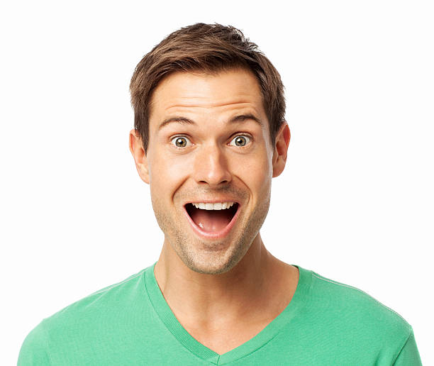 Portrait of surprised young man with mouth open over white background. Horizontal shot.