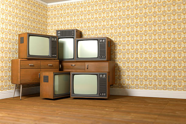 istock Group of old piled televisions in a vintage room 502198165
