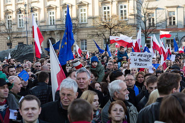 Cracow, Main Square - The demonstration Cracow, Poland - December 19, 2015: Cracow, Main Square -  The demonstration of the Committee of the  Protection of the Democracy /KOD/ against the break of law through the government PIS in Poland.  solidarity labor union stock pictures, royalty-free photos & images