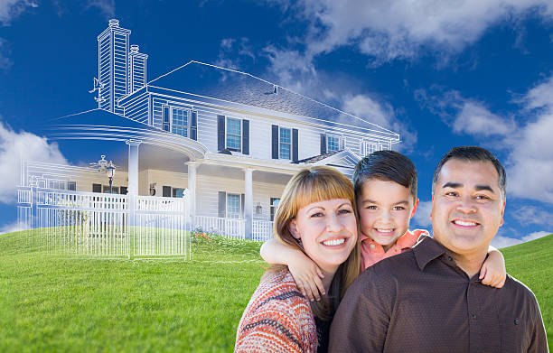 istock Young Mixed Race Family and Ghosted House Drawing on Grass 502210282
