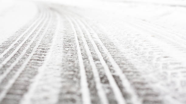 istock Wheel tracks on the road covered with snow 502213028